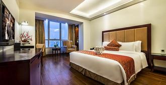 Haikou Baofa Shengyi Hotel - Hải Khẩu - Phòng ngủ