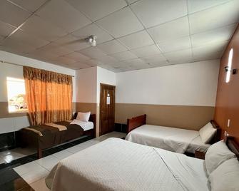Hotel Alpachaca - Tababela - Camera da letto