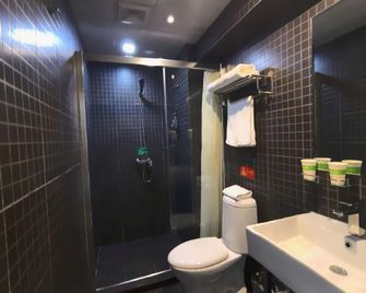 Motel Harbin Central Avenue Saint Sophia Cathedral Toulong Commercial Building - Harbin - Bedroom