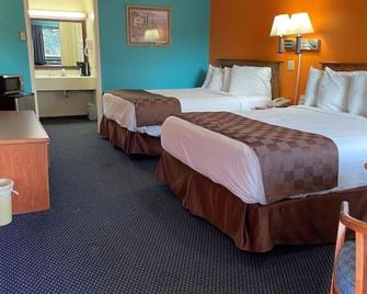 Asam Hotel - Goodland - Bedroom