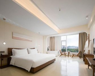 Sanya Tangyu Homestay (Haitang Bay Duty Free City Branch) - Санья - Спальня