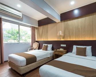Super OYO Capital O 90125 Hotel Grand Orchard - Kuala Lumpur - Bedroom