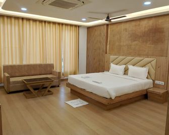 Hotel Shanti International - Deoghar - Schlafzimmer