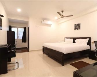 Hotel Mn Stays - Vijayawada - Schlafzimmer
