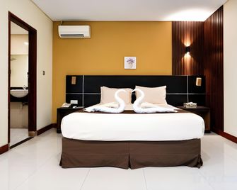 Dgria Hotel Serang by Tripletree - Serang City - Bedroom