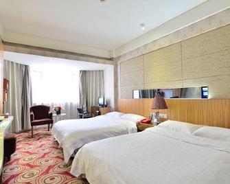Jinlong City Hotel (Wuzhou Fourth Middle School Sun Plaza) - Wuzhou - Habitación