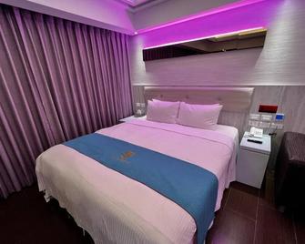 A Plus Motel - Taoyuan City - חדר שינה