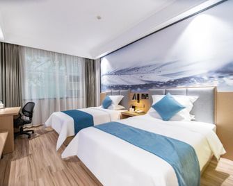 Chuxing Xinxuan Hotel (Jingmen Yintai City Store) - Jingmen - Camera da letto