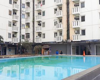 Homey and Compact 2BR Cibubur Village Apartment - Depok - Pool