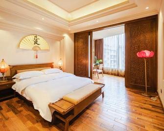 Liaokuo Jingshe Hotel - Qujing - Bedroom