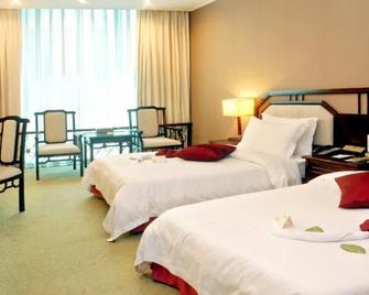Nanning International Hotel - Nanning - Yatak Odası
