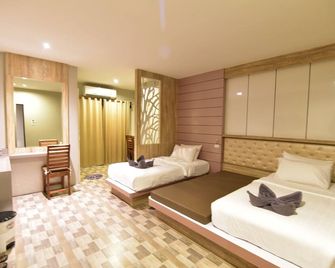 ريكي هاوس ريزورت - جزيرة كو ليبي - غرفة نوم