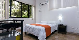 ホテル デ アルボラーダ - グアヤキル - 寝室