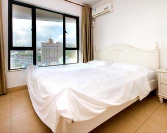 Sanya Wen Xin Hai Jing Apartement - Sanya - Habitación