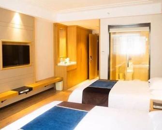 Greentree Inn Taizhou Taixing Middle Guoqing Road Business Hotel - Taizhou - Schlafzimmer