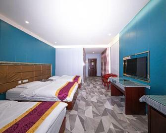Xinhua Business Hotel - Hami - Bedroom