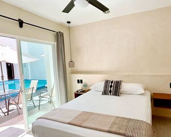 Hotel Caracol Isla Mujeres - Isla Mujeres - Schlafzimmer