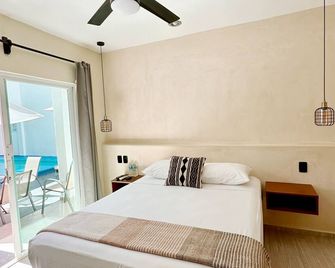 Hotel Caracol Isla Mujeres - איסלה מוחרס - חדר שינה