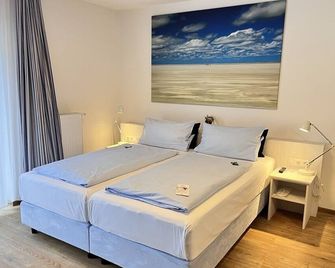 Hotel Garni Dünennest - זאנקט פטר אורדינג - חדר שינה