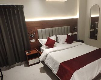 Vaishnavi Inn - Rājahmundry - Schlafzimmer