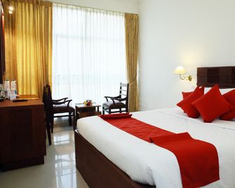 Hotel Palace Inn - Angamāli - Schlafzimmer