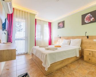 Tunacan Hotel - אולודניז - חדר שינה