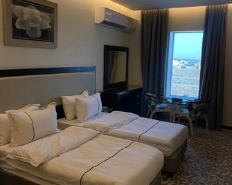 Mbn Artama Hotel - Unayzah - Bedroom