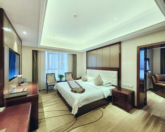 Hanzhong Rongjia International Hotel (Hanjiang Wetland Park Store) - Hanzhong - Спальня