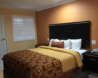 Executive Suites Inn - Westminster - Schlafzimmer