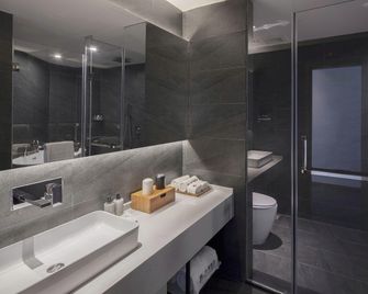 Qianna Hotel (Xinxiang Hualan Avenue Pangdonglai Shopping Plaza) - Xinxiang - Slaapkamer