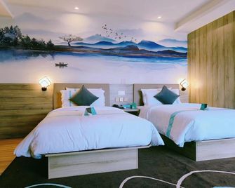 Xi'an Qingya Hotel (Xi'an International Convention and Exhibition Center Huaxia Culture Hotel) - Xi'an - Schlafzimmer