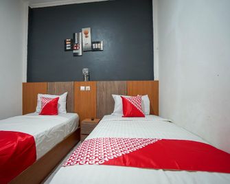 Hotel O Green Palm Kostel Syariah - Lubuklinggau - Bedroom