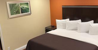Convention Center Inn & Suites - San Jose - Schlafzimmer