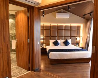 Brightland Resort & Spa - Mahabaleshwar - Schlafzimmer