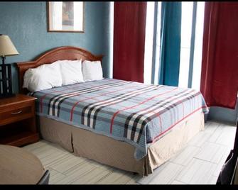 Relax Inn - Clinton - Schlafzimmer