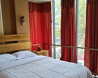 أوتيلو - كويتو - غرفة نوم