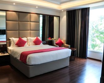 Tania President Inn - Shirdi - Slaapkamer