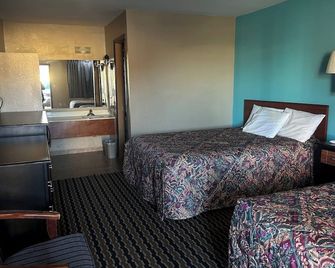 Crete Inn by Capital O Near Lincoln - Crete - Bedroom