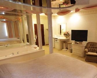 Magnolia Inn & Suites - Southaven - Schlafzimmer