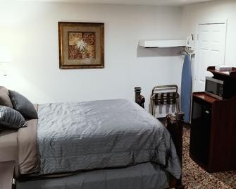 Coratel Inn & Suites by Jasper Hutchinson - Hutchinson - Schlafzimmer