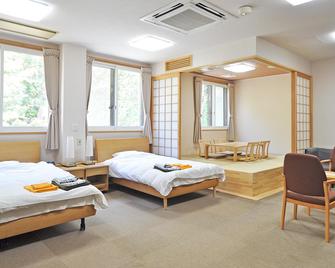 Utanobori Green Park Hotel - Hamatonbetsu - Bedroom