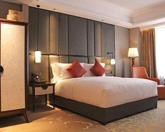 Yinlong Hotel - Xining - Schlafzimmer