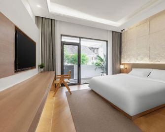 Purple Sea Fragrance Hotel - Mianyang - Camera da letto