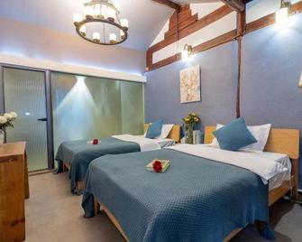 Delamu Inn - Lijiang - Bedroom