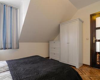 Pionow Rodzinne Apartamenty Urocza 10 - Krynica Morska - Phòng ngủ