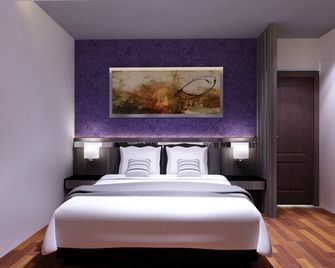 Neotel Hotel City Centre - Tanjung Redeb - Bedroom