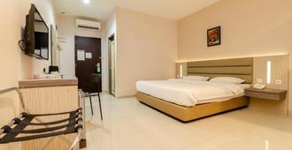 Lovina Inn Hotel Batam - Batam - Makuuhuone