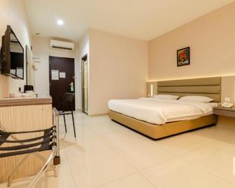 Lovina Inn Hotel Batam - Batam - Habitación