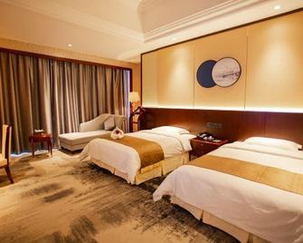 Anyang Huaqiang Nuohuating Hotel (Cultural and Sports Center Stadium) - Anyang - Camera da letto