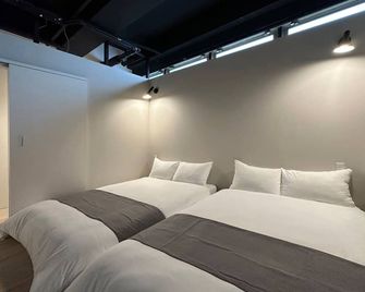 Small Hotel - Hostel - הירושימה - חדר שינה